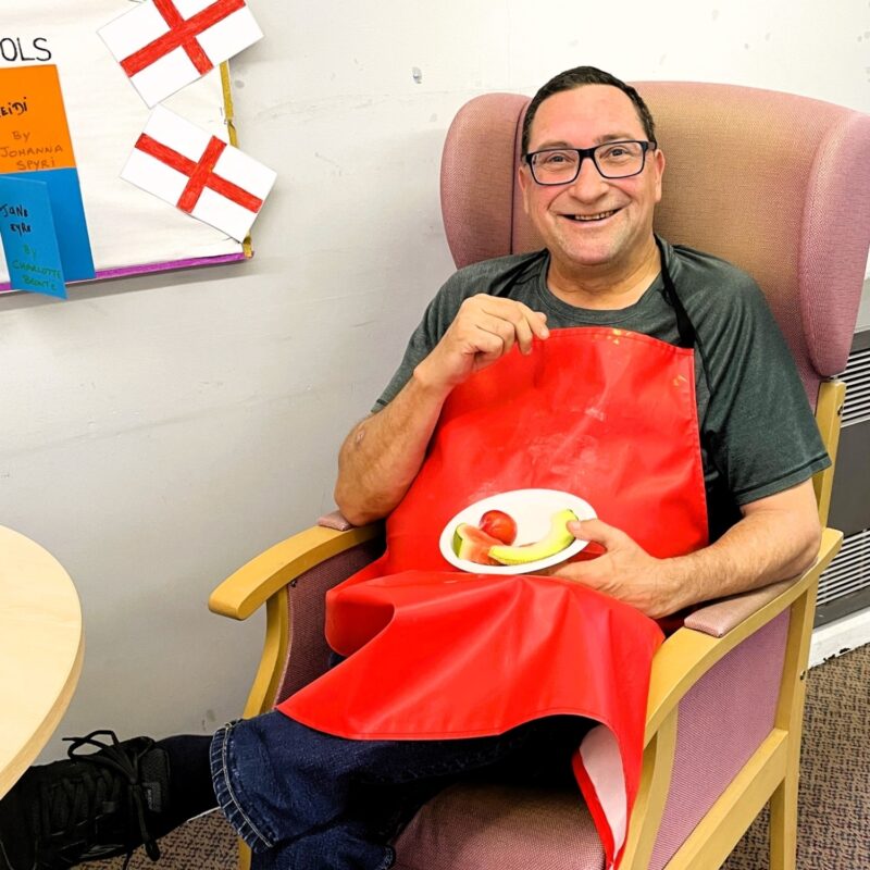Smiling gentleman enjoying selection of fruit