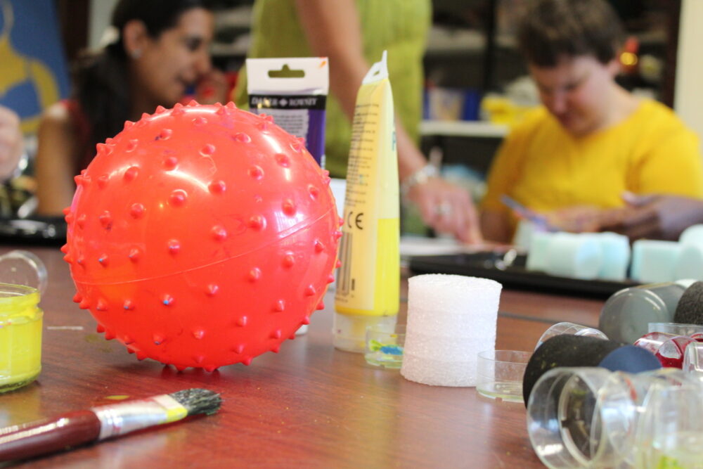 Art session at community lives, using sensory objects