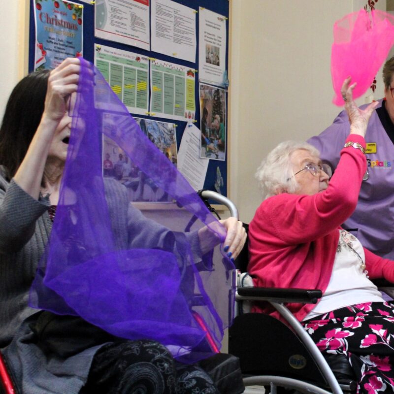 Juggling silk scarves