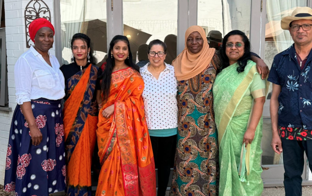 Team members in traditional cultural dress