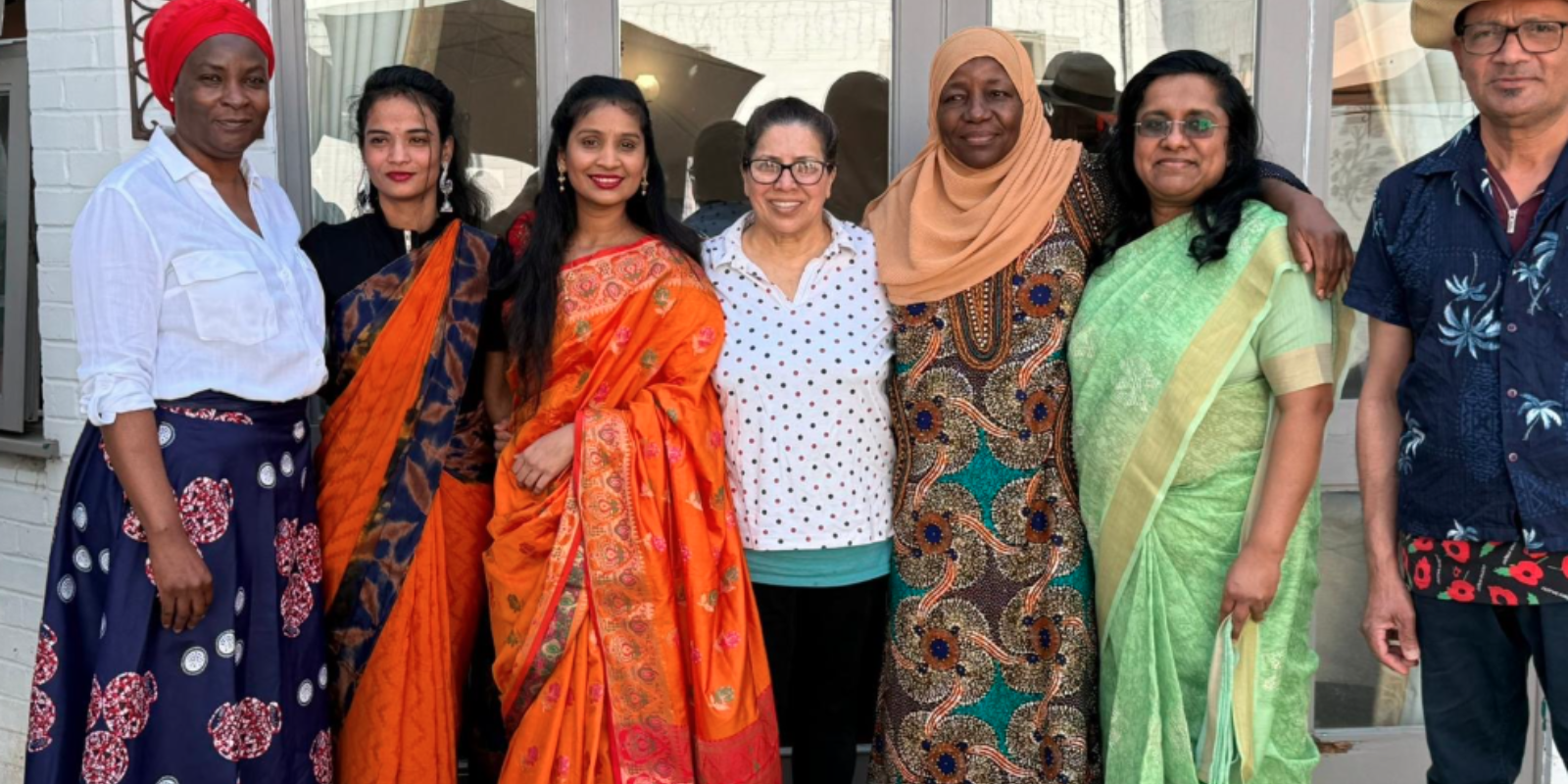 Team members in traditional cultural dress