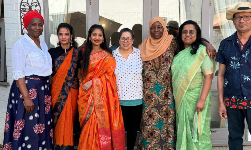 Team members in traditional cultural dress