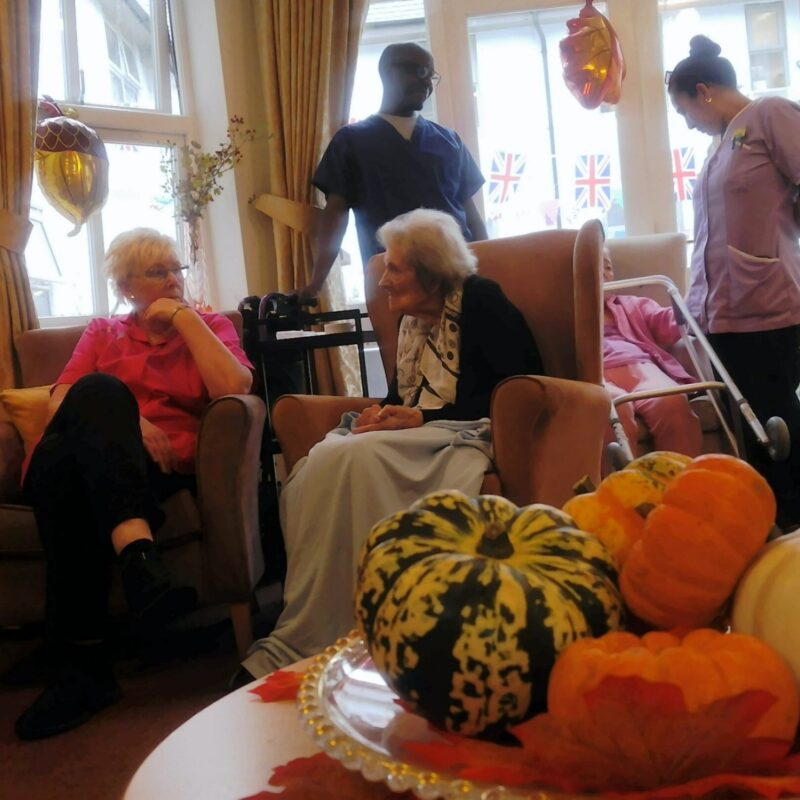 Sitting in lounge with harvest decorations