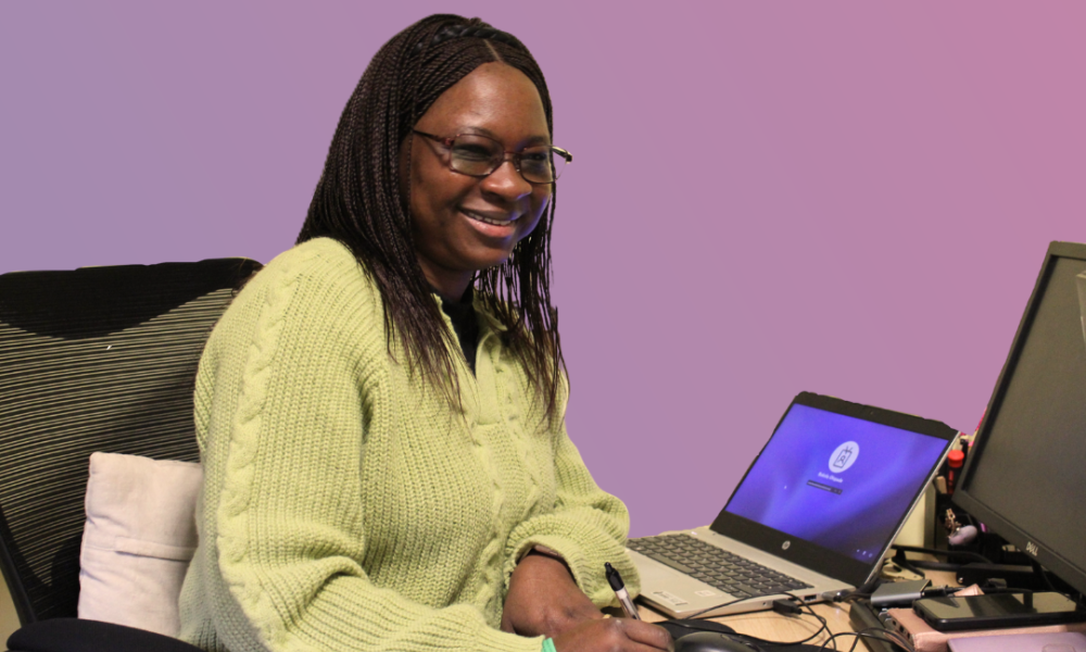 Bukola working at desk