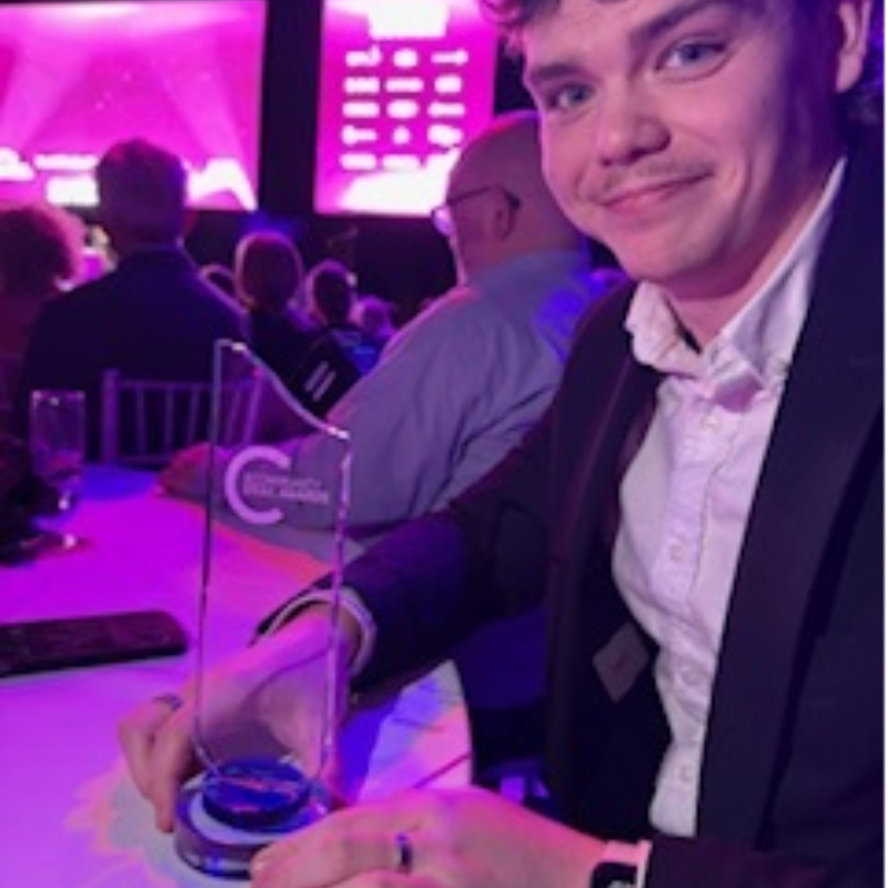 Team member with award