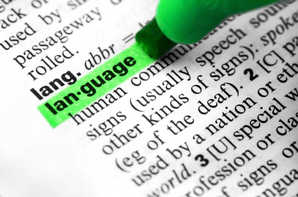 Close up language word concept definition highlighting dictionary