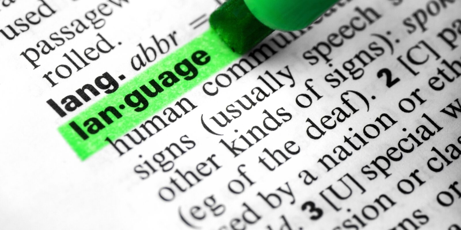 Close up language word concept definition highlighting dictionary