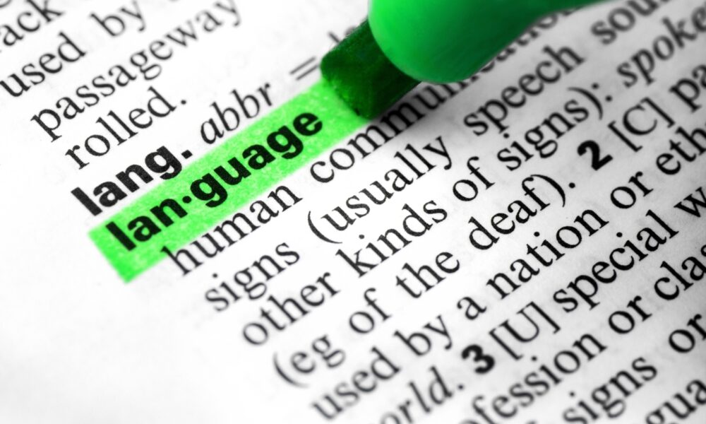 Close up language word concept definition highlighting dictionary